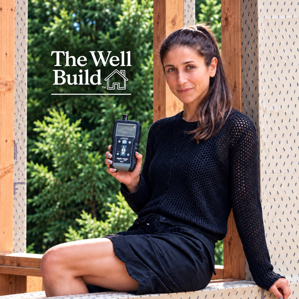 Rachel of The Well Build on site with a monitoring meter